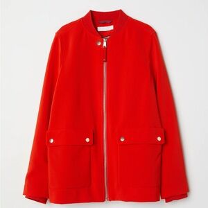 Jacket in woven fabric with a small, ribbed stand-up collar.